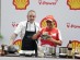 Felipe Massa holding the Carrot V Dumplings alongside Ryan Clift