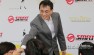 Desmond Kuek shakes hands with beneficiaries from BizLink