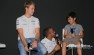 Eight-year-old Alex Kattoulas gets to speak to Lewis Hamilton in Person as Nico Roseberg looks on.