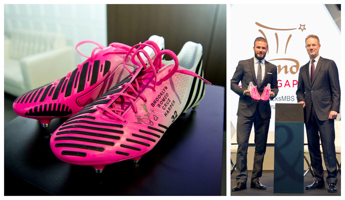 David Beckham with his autographed football boots which will be auctioned during Celebrities Give Back to Singapore auction as part of Sands for Singapore Festival in August