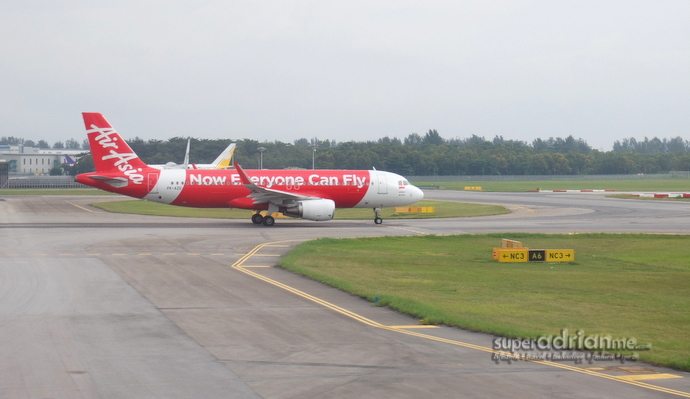 AirAsia A320 aircraft taxiing at Changi Airport