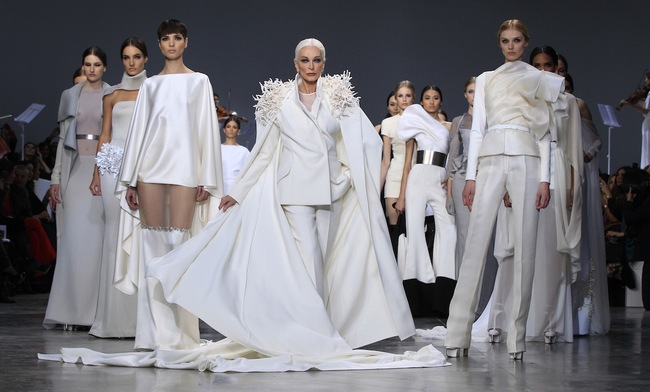 Carmen Dell'Orefice, 81, presents creations by French designer Rolland as part of his Haute Couture Spring-Summer 2013 fashion show in Paris