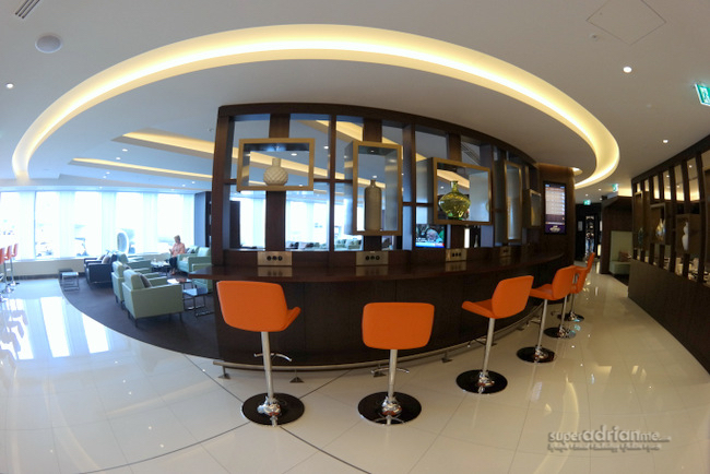 Etihad Airways First & Business Lounge Sydney - Stools and high desks with power points for you to work in the lounge. 