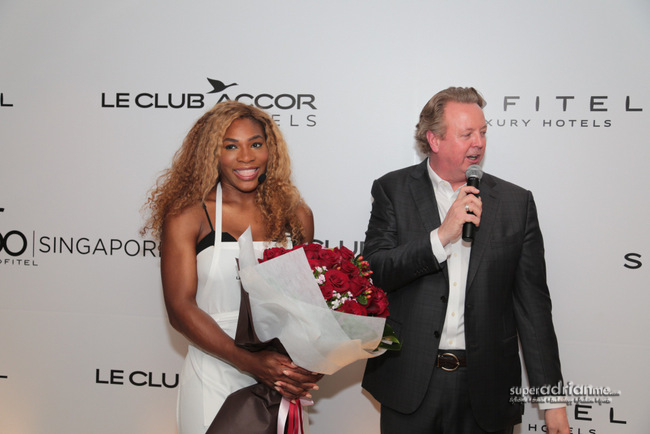 Serena Williams receives a bouquet at Sofitel So Singapore