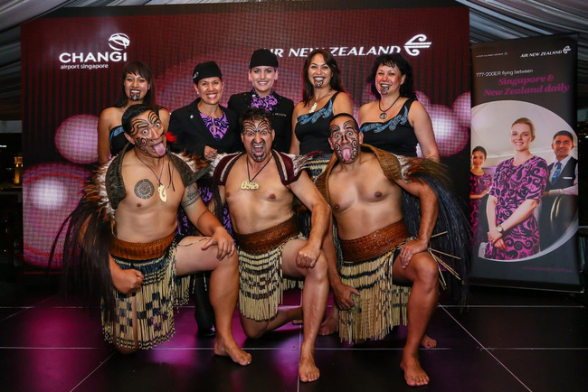 Air New Zealand staff in Maori outfits greet guests with a traditional Kapa Haka performance.
