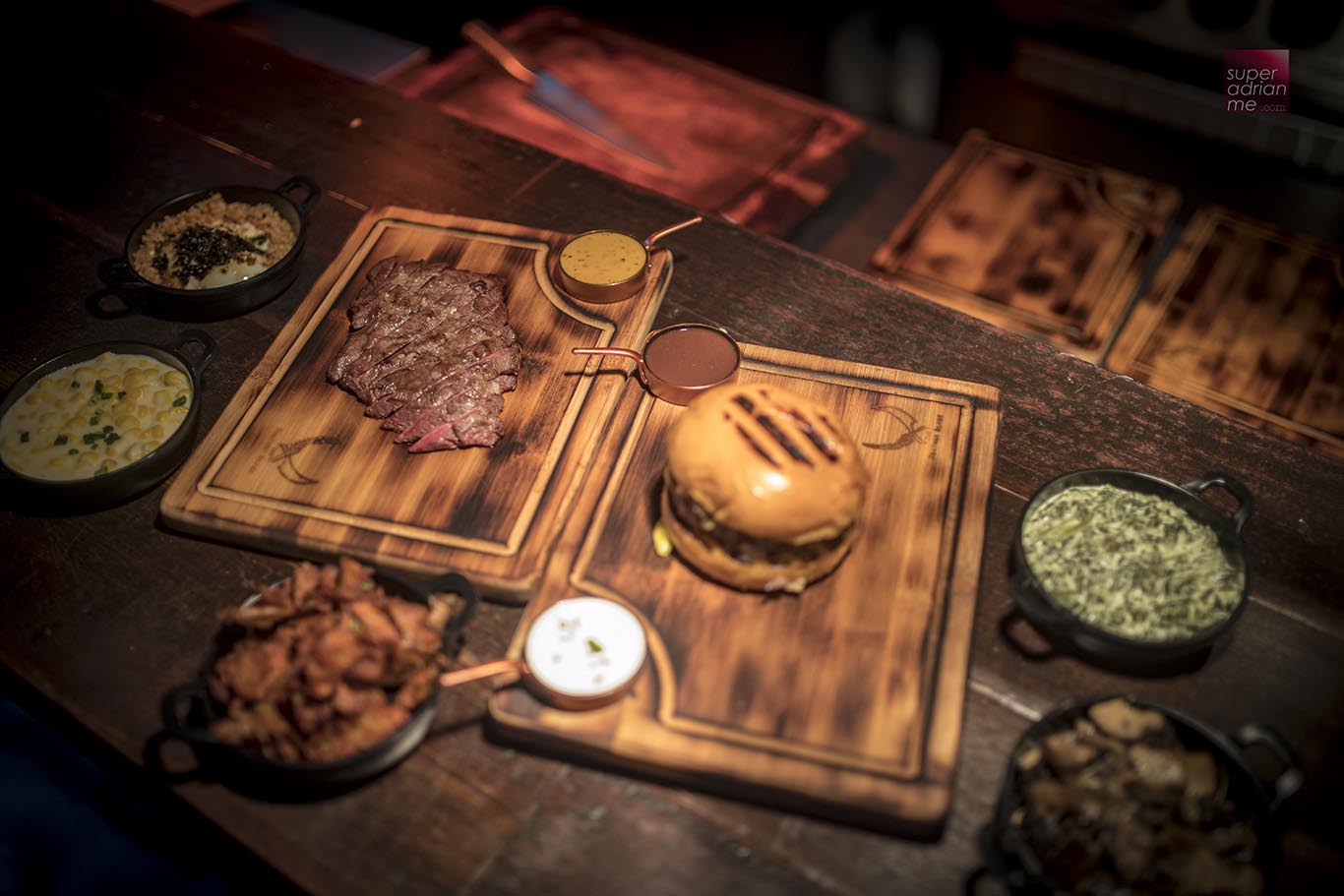The Feather Blade Steak and Burger with sauces and sides