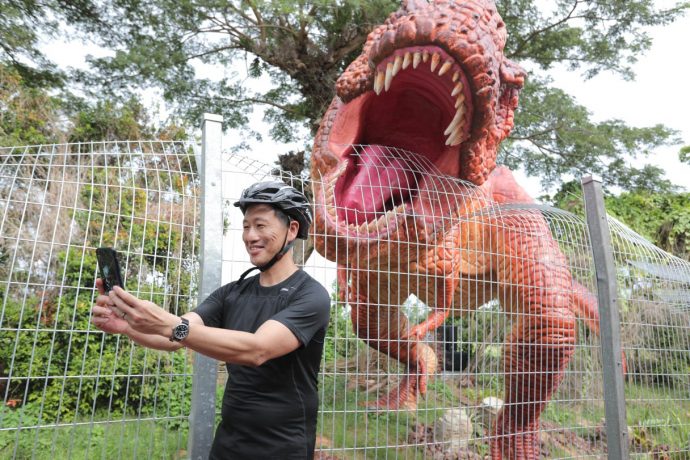 Minister Ong Ye Kung taking a selfie with T-Rex (Changi Airport Group photo)