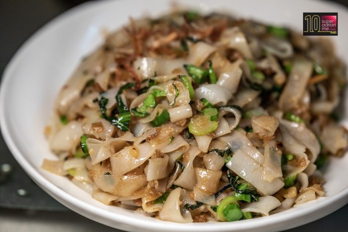 Wok-fried Kway Teow with Diced Kai Lan and Preserved Radish