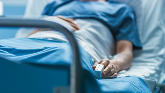 In the Hospital Sick Male Patient Sleeps on the Bed. Heart Rate Monitor Equipment is on His Finger. | SUPERADRIANME.com In the Hospital Sick Male Patient Sleeps on the Bed. Heart Rate Monitor Equipment is on His Finger.